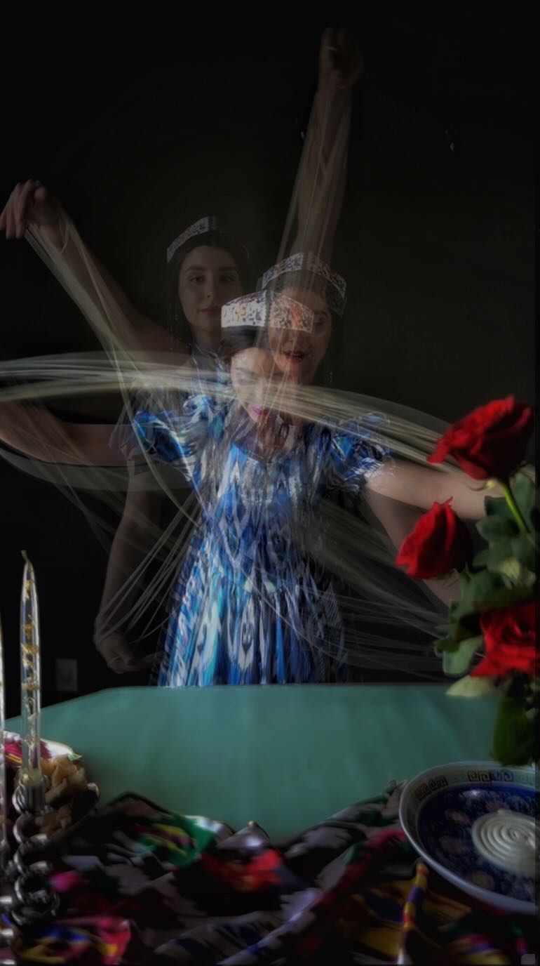 Ayesha Erkin at a candlelit dinner table