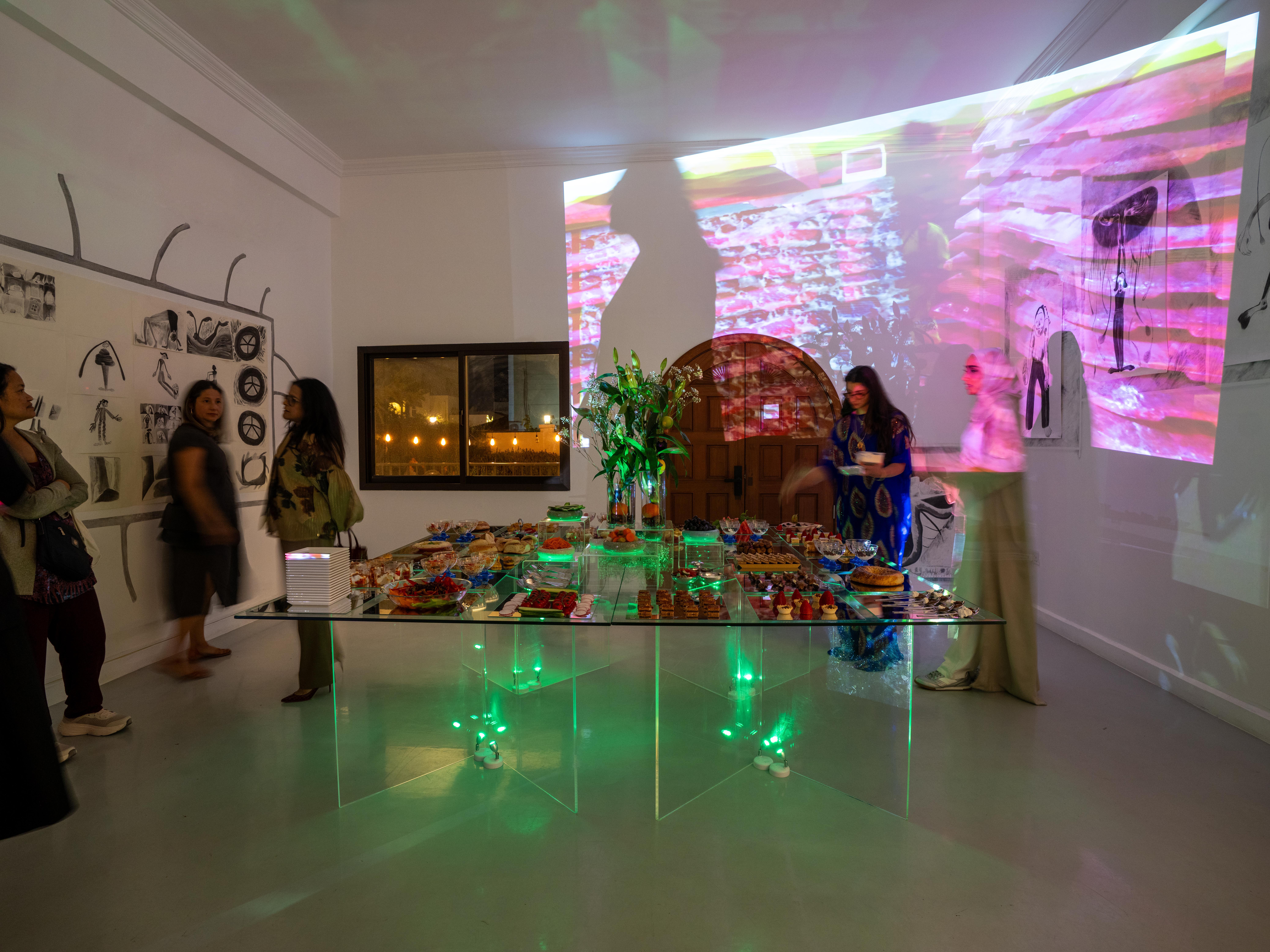 Illuminated glass banquet installation in a gallery